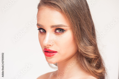 Eyelashes Makeup. Woman Beauty Face With Black Lashes Extensions and Red Lips