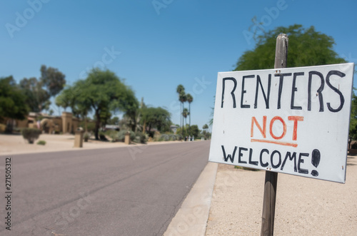 Renters Not Welcome Sign Concept Image on residential street. Unhappy neighbors create a notice to show their anger at noise and anti social behavior from vacationers staying on the street.