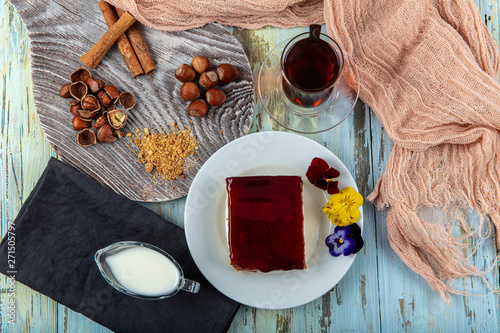 Turkish Traditional Trilece Caramel Dairy Dessert Cake. Sweet presentation concept on wooden table. photo