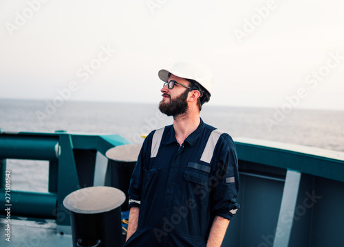 Deck Officer on deck of offshore vessel or ship , wearing PPE personal protective equipment