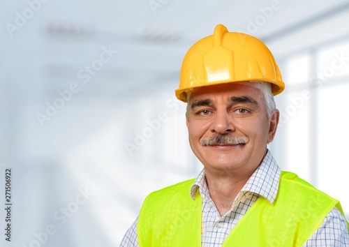 Construction worker with tools in empty building