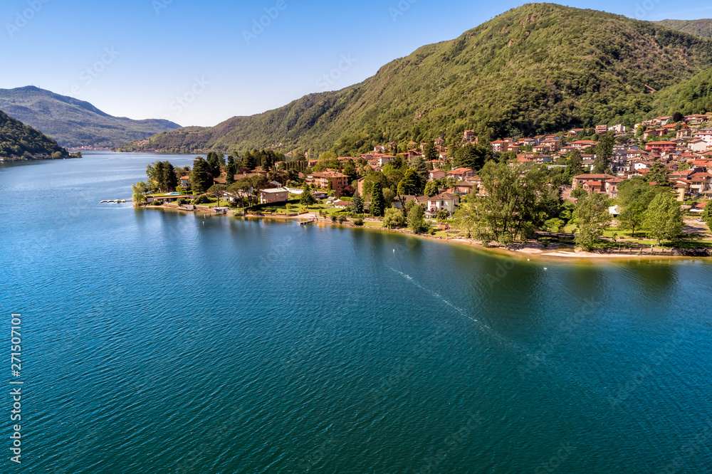 Aerial view of small village Brusimpiano located on the shore of lake Lugano, Italy