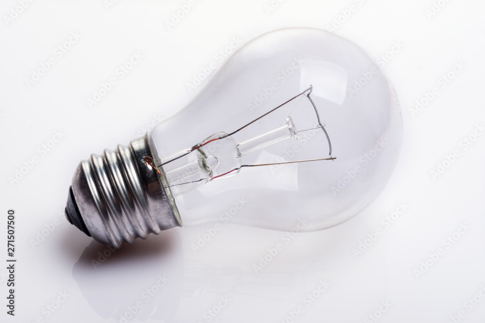 Light bulb on white background. Close up. Selective focus. Light bulb on white background. Close up. Selective focus.