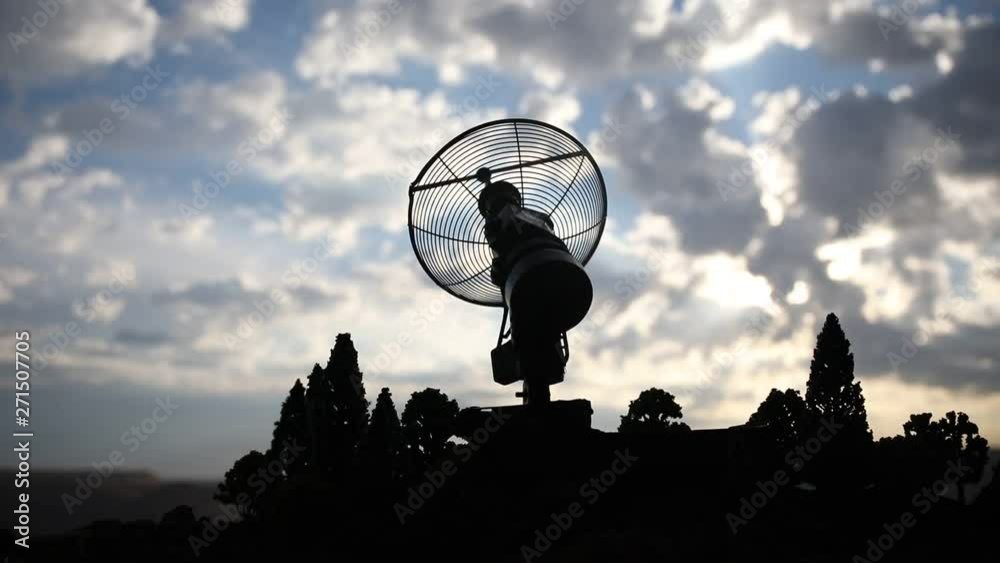 Silhouettes of satellite dishes or radio antennas against night sky. Space observatory or Air defence radar over dramatic sunset sky. Creative artwork decoration. Selective focus Silhouettes of satellite dishes or radio antennas against night sky. Space observatory or Air defence radar over dramatic sunset sky. Creative artwork decoration. Selective focus