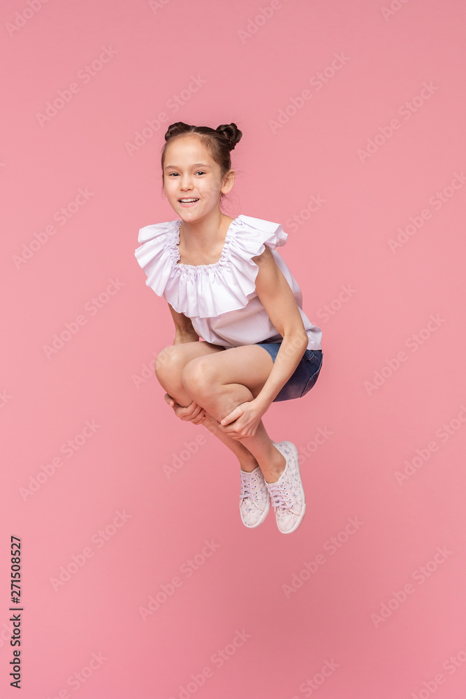 Active happy little girl jumping in bomb style Active happy little girl jumping in bomb style
