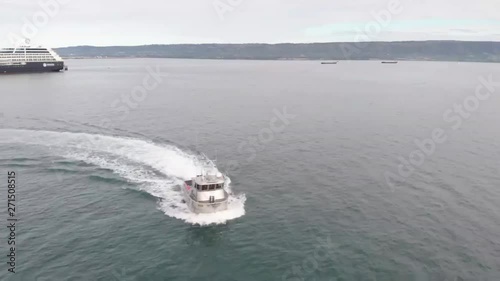 Spectacular views of Kachemak bay and the busy Homer Alaska boat harbor on the spit.