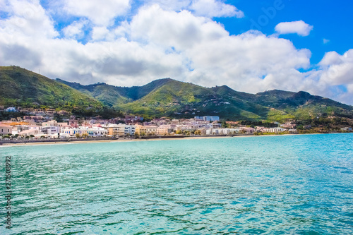 Amazing landscape with Tyrrhenian coast by Sicilian city Cefalu. The beautiful small village is one of the major tourist attractions in Italy. Taken with clouds and partly blue sky above