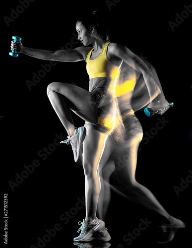 one mixed race woman exercising fitness exercises isolated on black background with lightpainting effect multiple exposures