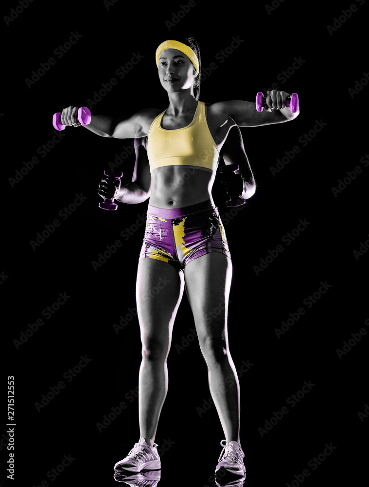 one mixed race woman exercising fitness exercises isolated on black background with lightpainting effect multiple exposures one mixed race woman exercising fitness exercises isolated on black background with lightpainting effect multiple exposures