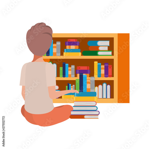 man sitting with stack of books