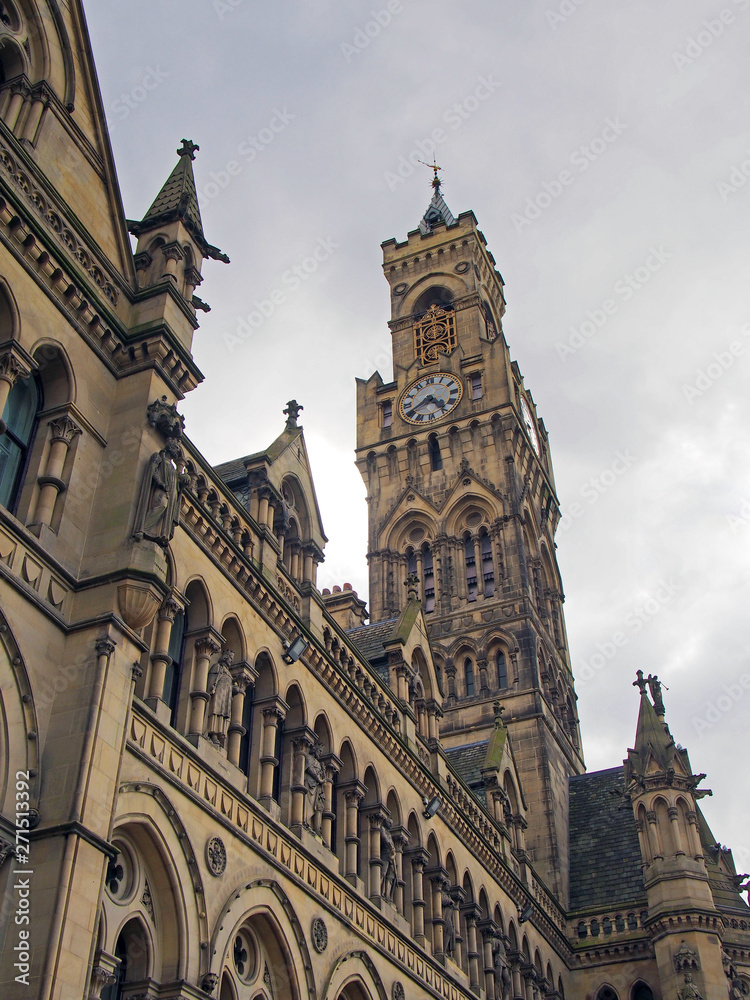 a view of bradford town hall in west yorkshire showing ornate gothic architecture and clock tower