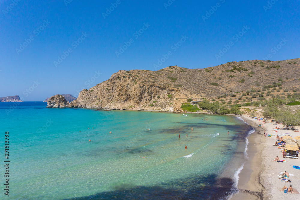 Panoramic view of Plathiena beach with turquoise waters in Milos, Greece