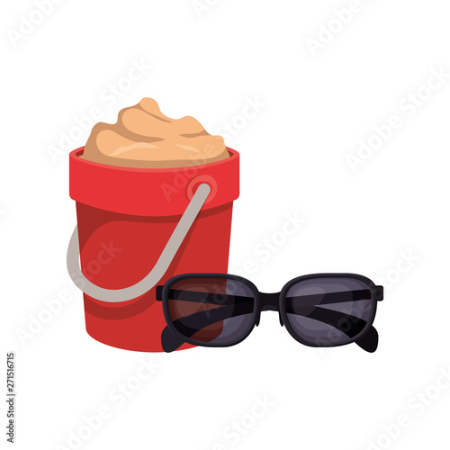 sand bucket with sunglasses on white background