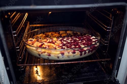 Homemade cake with fruit in oven