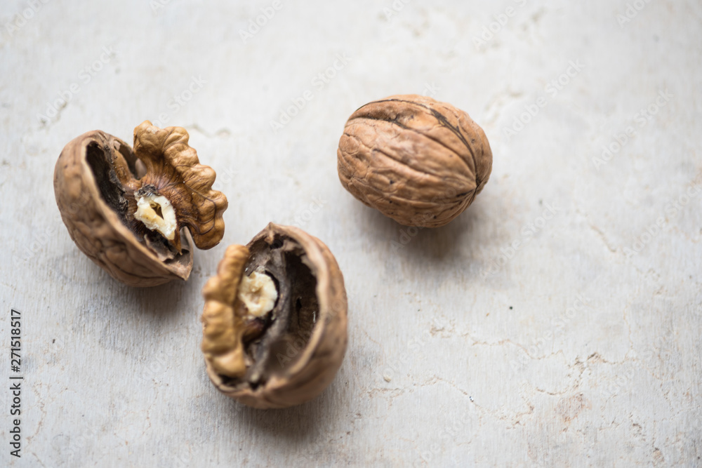 Delicious walnut on stone plate broken hard shell.