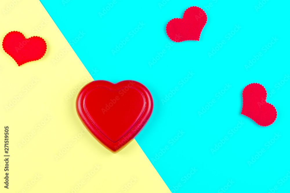 Red heart on yellow and blue background for Valentine day to romantic, love concept and idea for postcard and copy space.