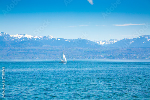 Image of Geneva Lake with Sailing boat and mountains on the background
