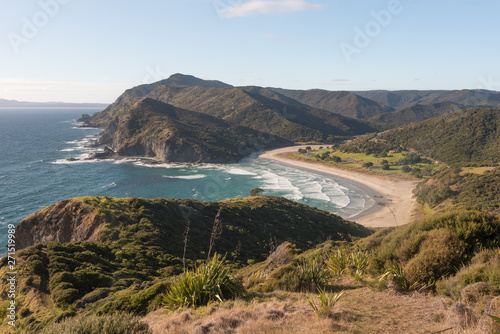 Elevated view of Tatoputopu Bay from the coastal walking track to Cape Reinga, Northland, New Zealand. photo