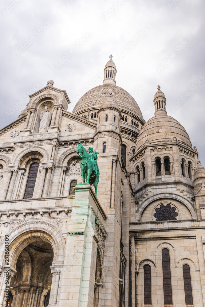 Paris, France - APRIL 8, 2019:  View of Sacre Coeur Basilica on a cloudy day. Basilica of Sacred Heart. Paris, France