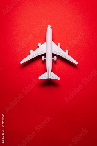  jet airplane travel concept, minimal art, on red background.