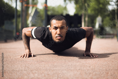 African Fit Man Doing Push-Ups In Park