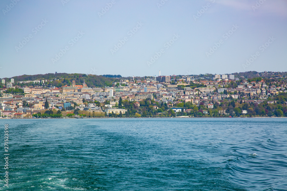 Panorama of Lausanne city taken from boat on Geneva Lake