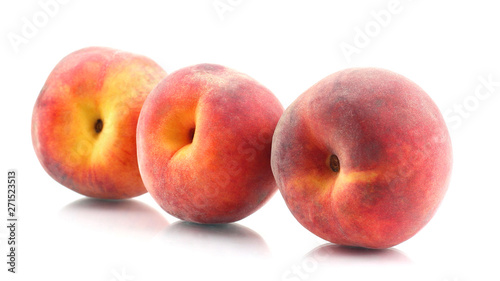 three ripe peach on a white background