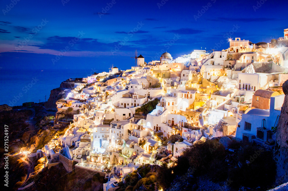 impressive evening view of Santorini island. Picturesque spring sunset on the famous Greek resort Oia, Greece, Europe. Traveling concept background.