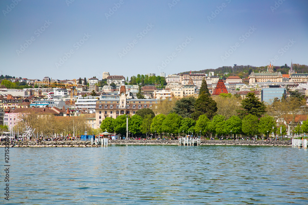 View of Lausanne city taken from ferry boat on Lake Geneva in Switzerland 
