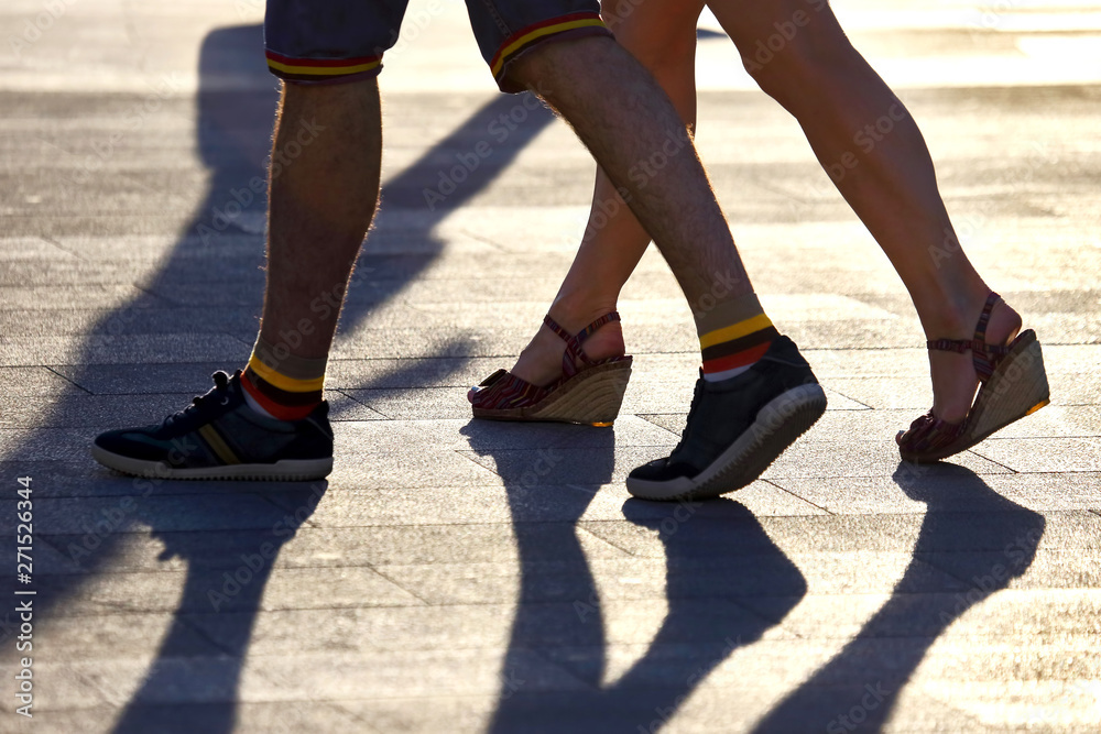 silhouette running two pairs of legs in backlight sunlight silhouette running two pairs of legs in backlight sunlight