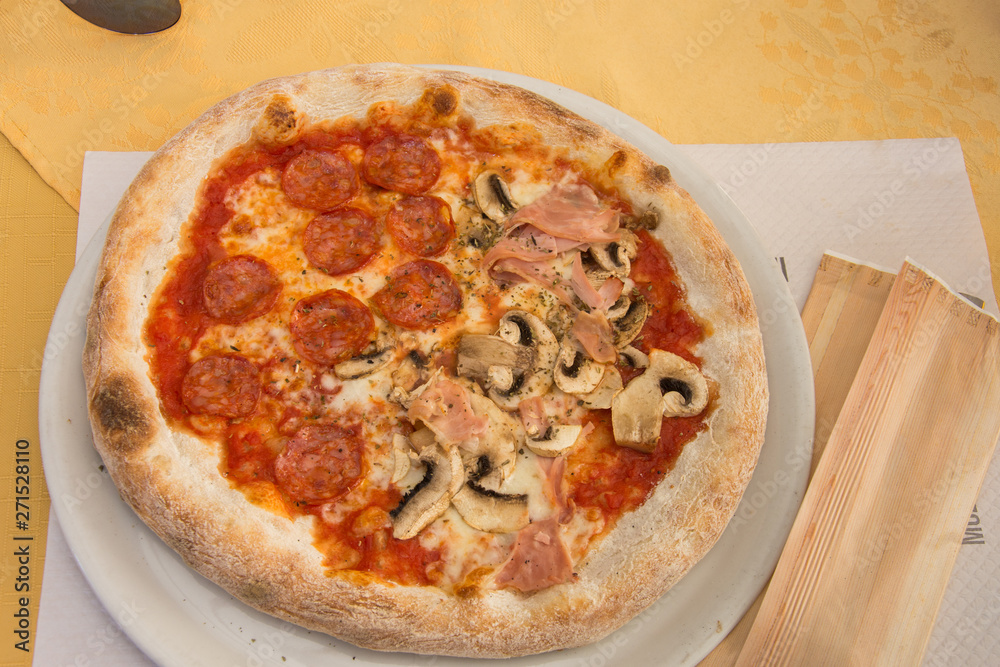 Delicious Pizza Isolated on a white plate Delicious Pizza Isolated on a white plate