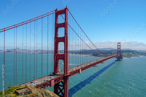 Fototapeta Naklejka Na Ścianę i Meble -  Famous Golden Gate Bridge. Suspension bridge spanning the Golden Gate. The structure links the American city of San Francisco, California, the northern tip of the San Francisco Peninsula to Marin C