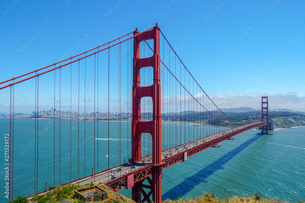 Famous Golden Gate Bridge. Suspension bridge spanning the Golden Gate. The structure links the American city of San Francisco, California, the northern tip of the San Francisco Peninsula to Marin C