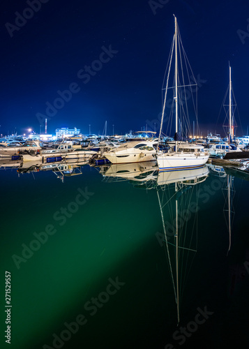 Ships in the harbor under the night starry sky. Black Sea, Sochi, Europe