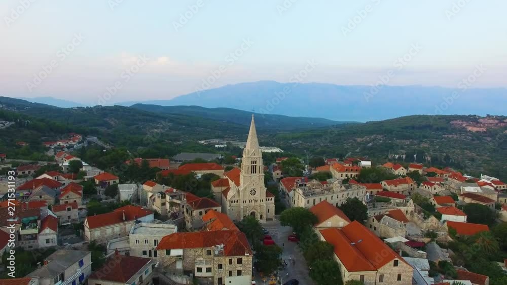 Descending aerial view of St, Nicholas Church in Selca Croatia Europe Descending aerial view of St, Nicholas Church in Selca Croatia Europe