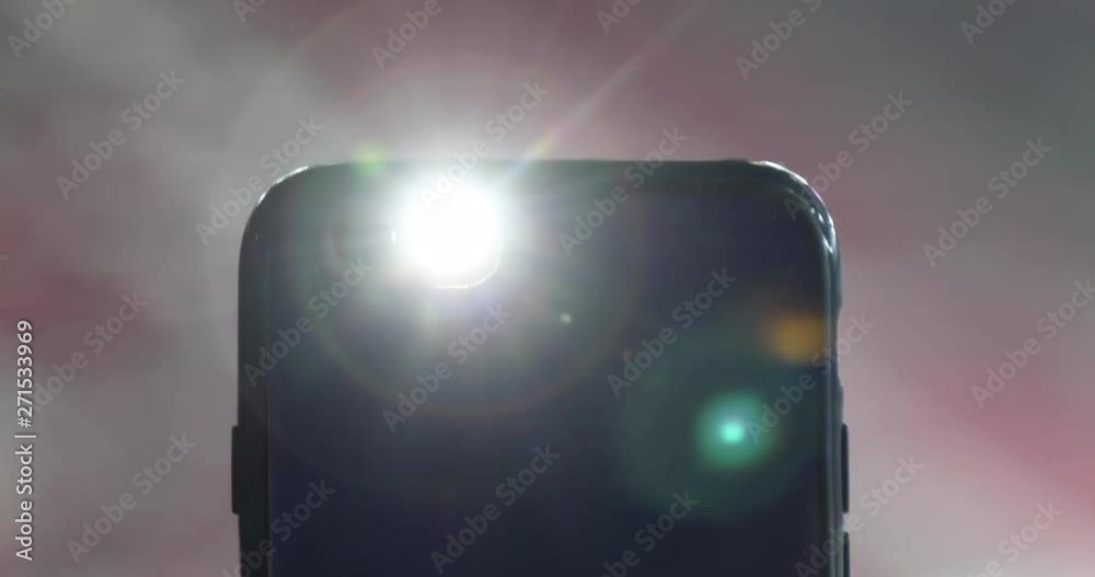 Smartphone Flashlight Gleaming at Camera