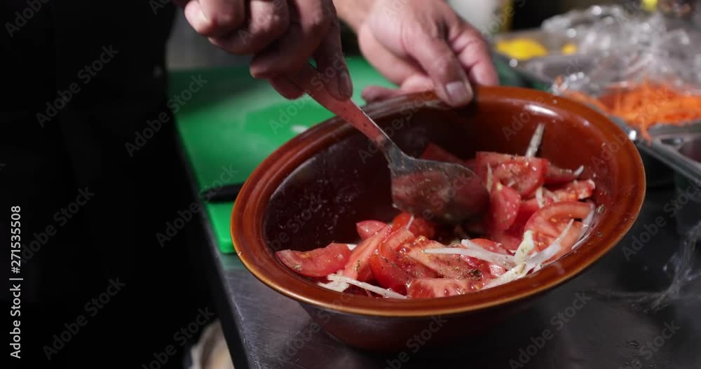 Reverse Slow Motion Shot Of Mixing Tomatos And Onions Salad With A Spoon For Lunch - 4 K 30fps Reverse Slow Motion Shot Of Mixing Tomatos And Onions Salad With A Spoon For Lunch - 4 K 30fps