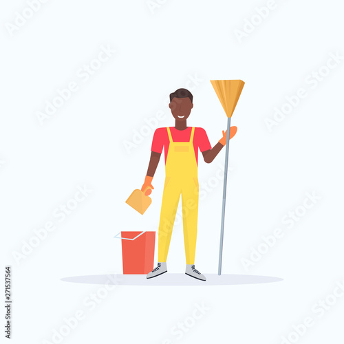 man holding broom african american guy cleaner sweeping floor cleaning service housekeeping concept full length flat white background