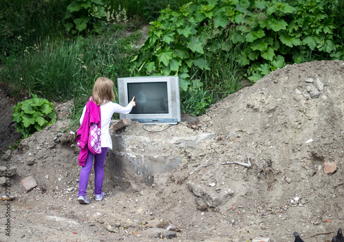 girl with old tv in nature