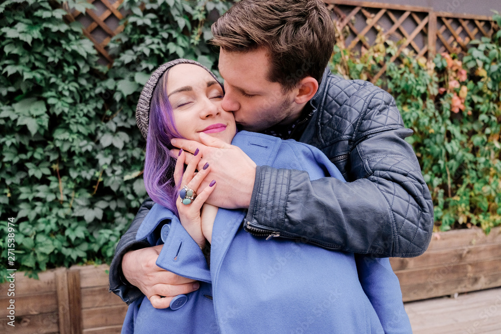 Woman and man smile when kissing. Woman and man smile when kissing.