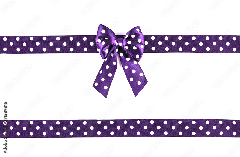 Shiny purple silk ribbon on white background.