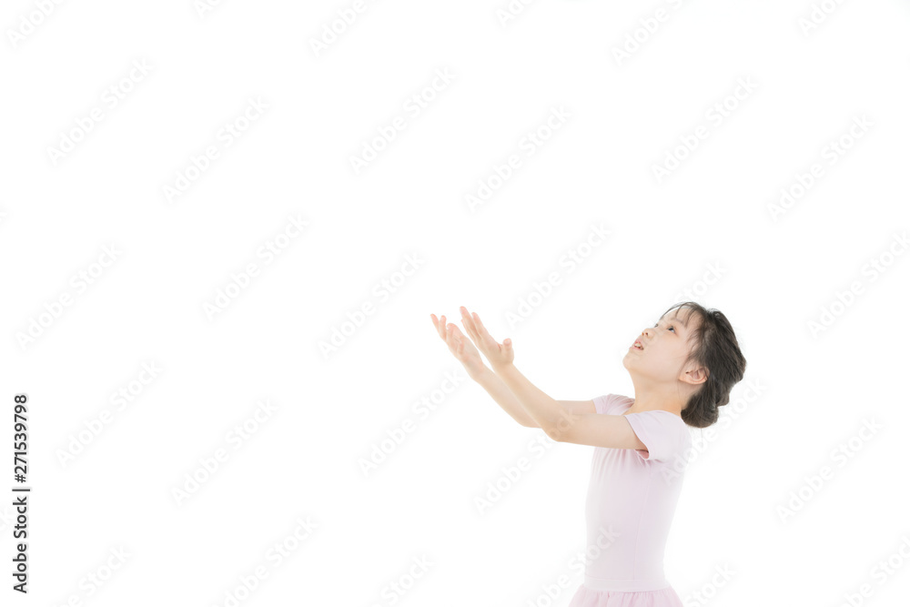 Pink dressed Asian girl in a ballet pose.. Pink dressed Asian girl in a ballet pose..
