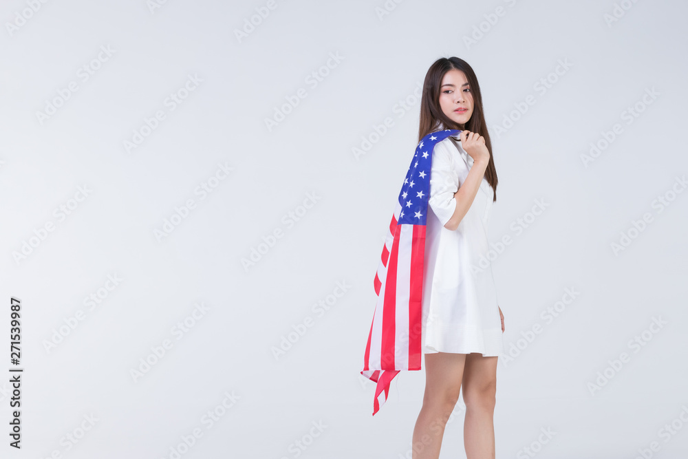 Asain woman holding American flag. Asain woman holding American flag.