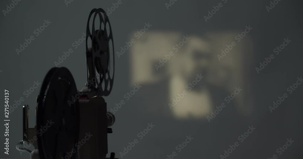 8 mm movie projector old retro old cinema in the dark room, 4K DCI