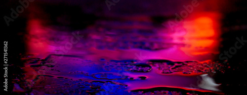 Dark background. Spilled li...