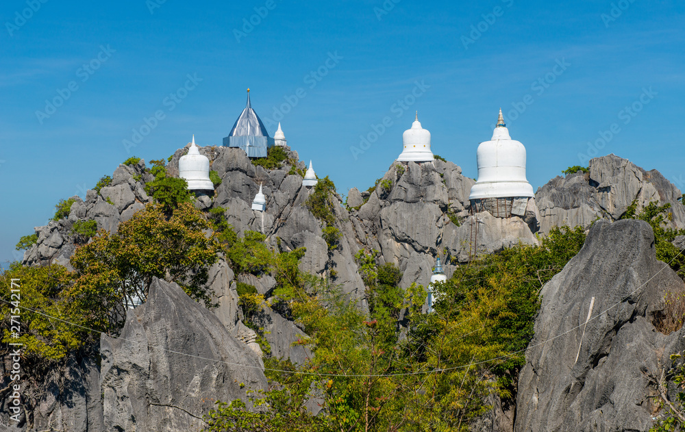 Fototapeta premium View of the floating pagodas in temple of Wat Chaloem Phra Kiat, One of the most tourist attraction place in Lampang province of Thailand.