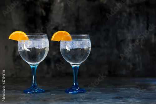 gin tonics on blue glass