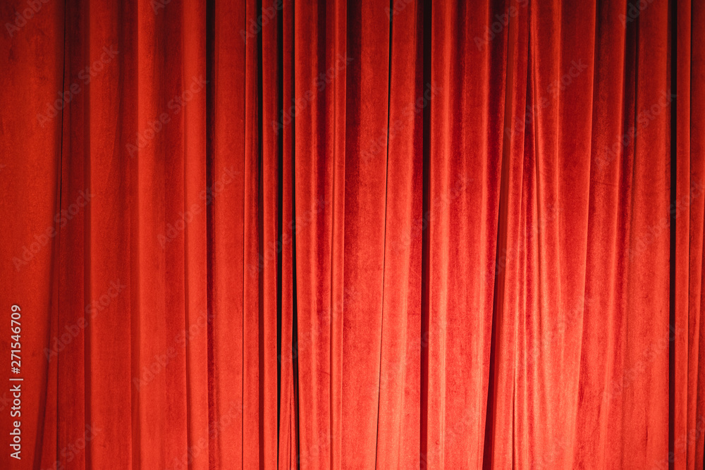 Red velvet curtain use in expensive design with dramatic lighting. Red velvet curtain use in expensive design with dramatic lighting.