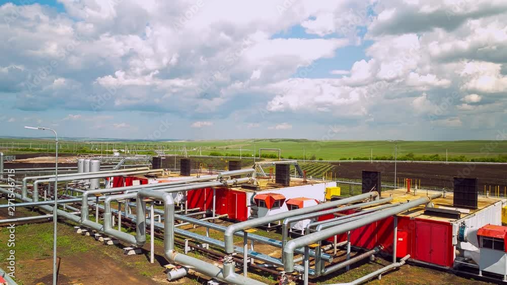 pipes with stations at gas and oil refinery plant timelapse