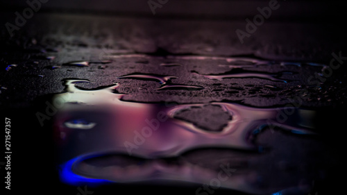 Dark background. Spilled li...